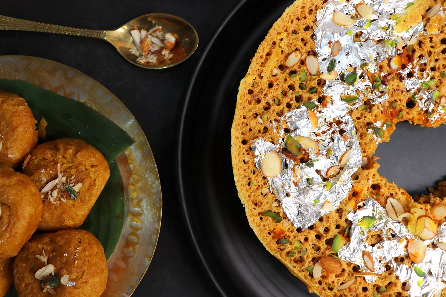 Ghewar sweet served with nuts